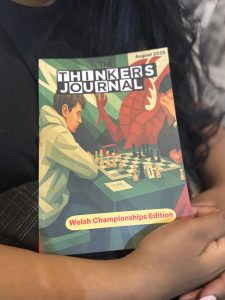 August Edition front cover in arms